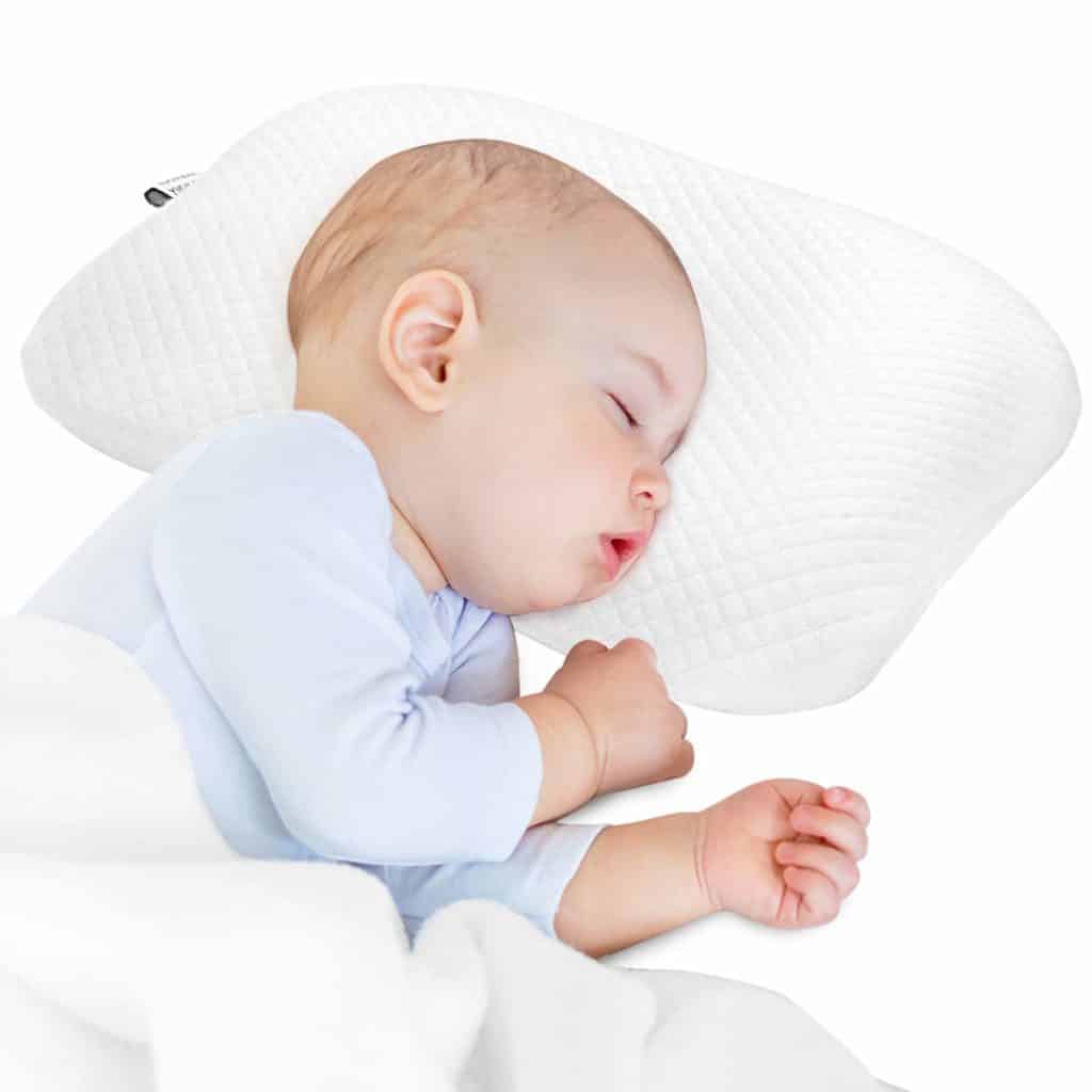 baby sleeping in flat head baby pillow