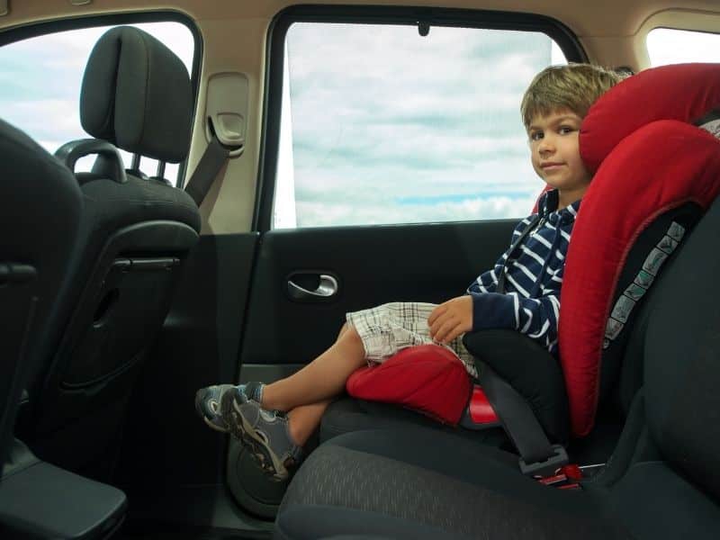 child sitting in car seat